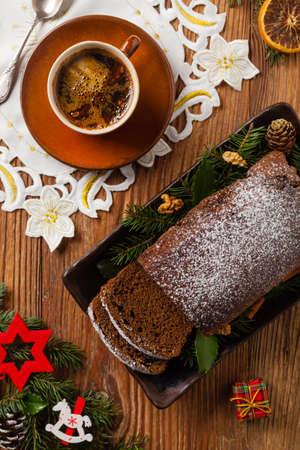 Homemade gingerbread cake. Christmas decoration. Top view. Natural wooden background.の写真素材