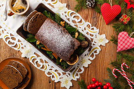 Homemade gingerbread cake. Christmas decoration. Top view. Natural wooden background.の写真素材