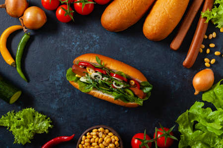 Vegetarian hot dogs with soy sausages and fresh vegetables. Top view.の写真素材
