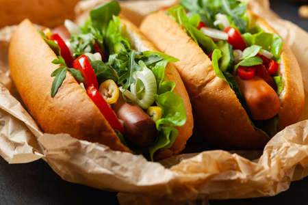 Vegetarian hot dogs with soy sausages and fresh vegetables. Front view.の写真素材