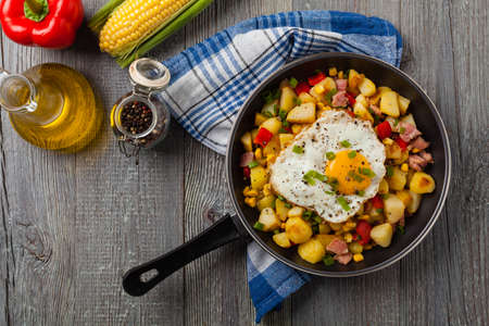 Traditional American hash with fried eggs. Top view.の写真素材