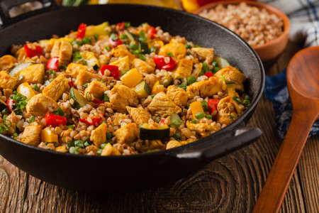 Buckwheat with chicken and vegetables. Front view.の写真素材