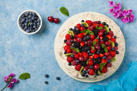 Meringue Pavlova cake with fresh fruit. Top view.の写真素材