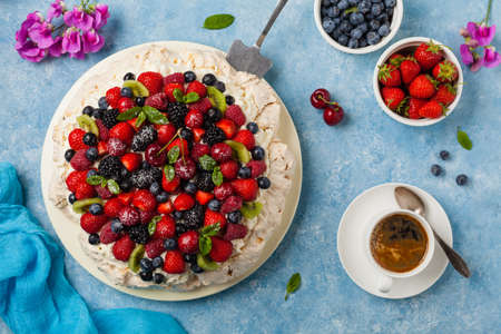 Meringue Pavlova cake with fresh fruit. Top view.の写真素材