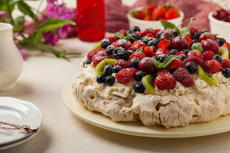 Meringue Pavlova cake with fresh fruit. Front view.の写真素材