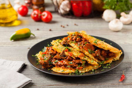 Hungarian potato pancake with goulash. Front view.の写真素材