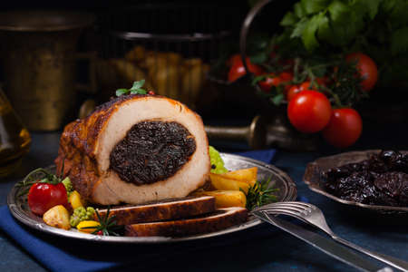 Whole roasted pork loin stuffed with dried plum.の写真素材