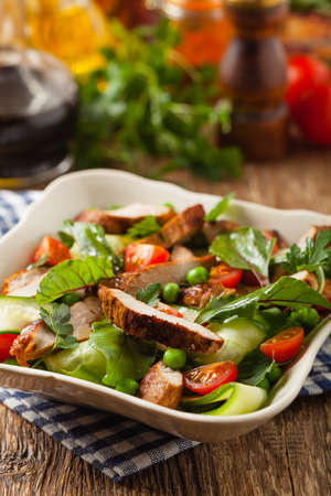 Delicious salad with grilled veal, beetroot and cucumber. Front view.の写真素材