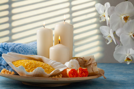 SPA accessories. Scented candles, shells, towels and bath salts. Candles and an intimate atmosphere.の写真素材