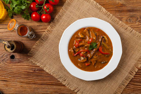Boeuf, Stroganov, Strogonov. Classic, Russian beef stew. Served on a white plate. Top view. Natural background.の写真素材