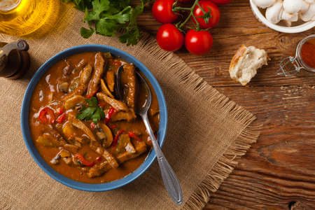 Boeuf, Stroganov, Strogonov. Classic, Russian beef stew. Served in a blue bowl. Top view. Natural background.の写真素材