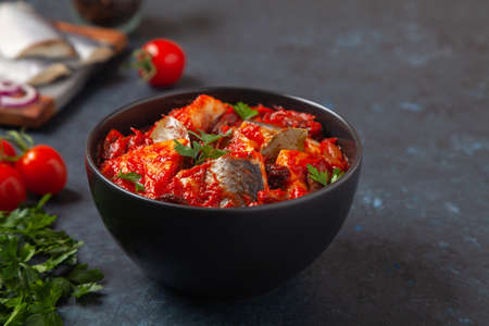 Herring fillet salad in tomato sauce with raisins.の写真素材
