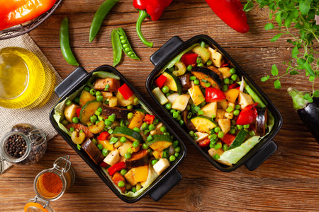 Vegan stew. Prepared in a roasting pan. Natural wooden background.の写真素材