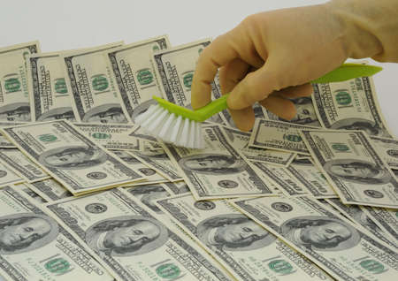 Money Laundering Scheme, Washing US Dollars. Symbol of Financial Fraud.の写真素材