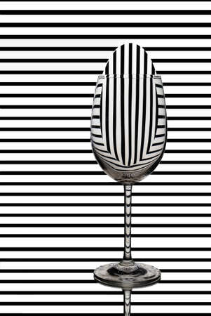  Elegant Tall Wineglass For Red Wine  Over Striped  Background.の写真素材