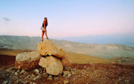 Woman Posing On The Judea Mountain Top At Sunsetの写真素材