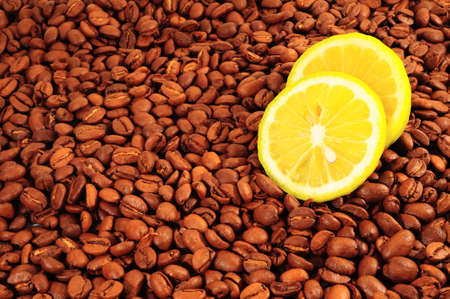  Lemon on Lots of Natural Roasted Coffee Beans Background. の写真素材