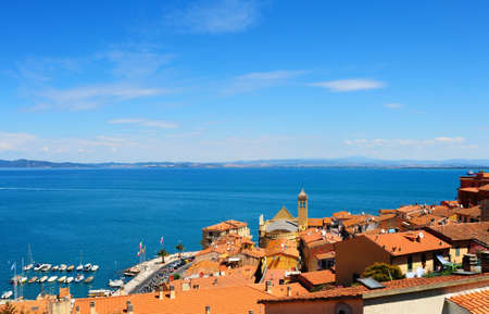 View Of The Harbor  Porto San Stefano From Tiled Roofsの写真素材