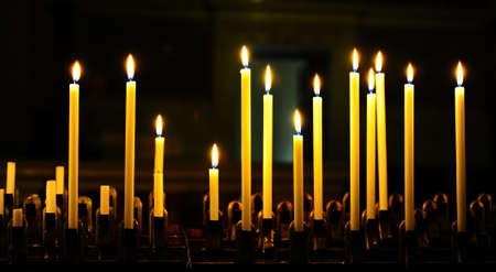 Burning Candles Before The Altar In The Churchの写真素材