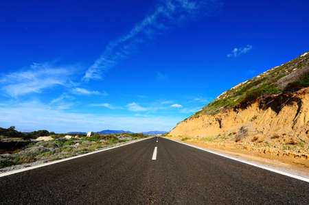 Straight Asphalt Road Along the Sea on the Greek Island of Rhodesの写真素材