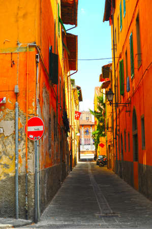 Narrow Alley With Old Buildings In Italian City of Pisaの写真素材