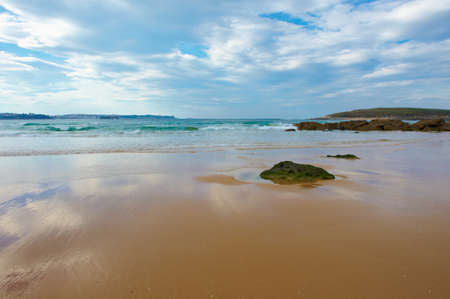 Clouds Reflected in a Tidal Wave on the Atlantic Coast in Spainの写真素材