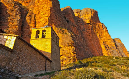 Spanish Medieval Church at the Foot of the Rocks in the Pyreneesの写真素材