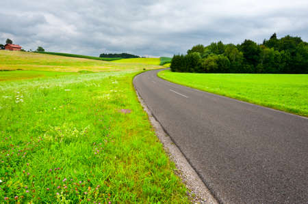 Road between Corn and Wheat Fields in Bavaria, Rainy Dayの写真素材