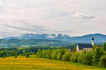 Church on the Hill on the Background of Snow-capped Alps, Germanyの写真素材