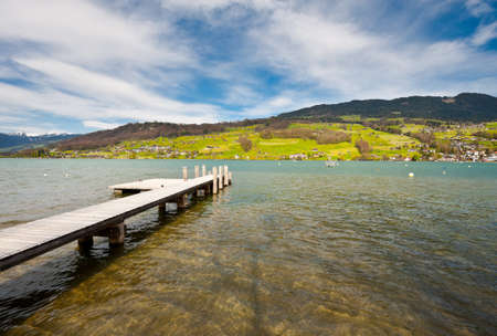 Lake Sarner on the Background of Snow-capped Alps, Switzerlandの写真素材