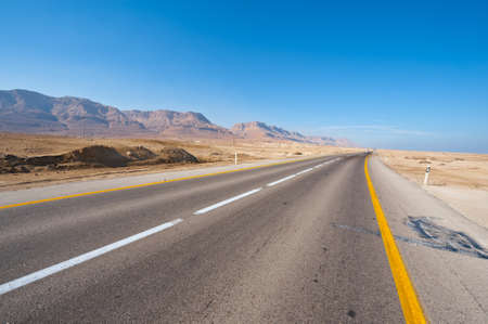 Asphalt Road in the Judean Desert on the West Bank of the Jordan Riverの写真素材