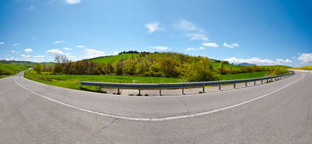 Asphalt Road between the Fields of Tuscany