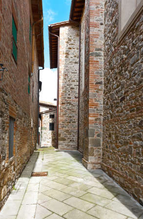 Narrow Alley with Old Buildings in Italian City の写真素材