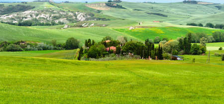Farmhouse and Green Sloping Meadows of Tuscany