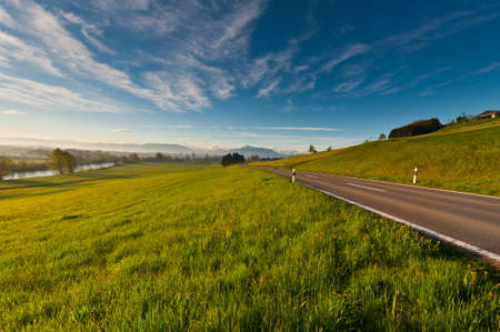 Pasture along the Irrigation Canal and Dam in Switzerlandの写真素材