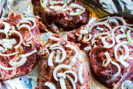 Raw Meat with Pepper and Onion on Foil