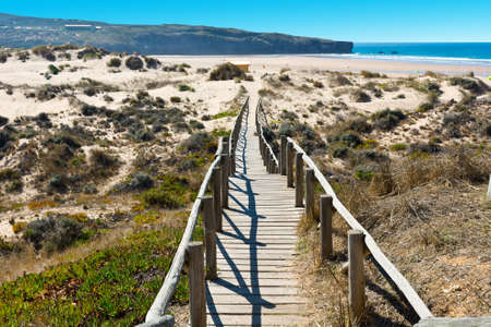 Wooden Footbridge across the Sand Dunes on the Atlantic coast of Portugalの写真素材