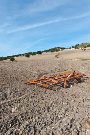 Plough on the Plowed Sloping Hills of Spain in the Autumnの写真素材