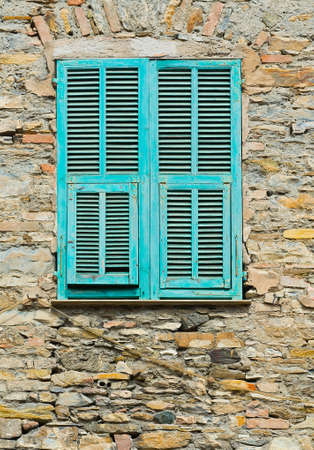 Italian Window with Closed Wooden Shuttersの写真素材