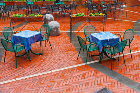 Chairs and Tables in a Street Cafe under the Rainのeditorial素材