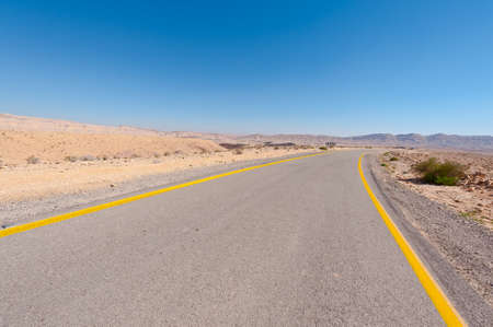 Winding Asphalt Road in the Negev Desert in Israelの写真素材