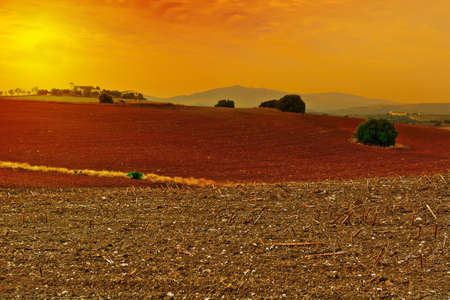 Farmhouse on the Plowed Field in Spain, Sunsetの写真素材