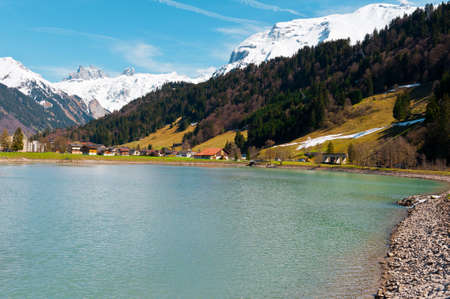 Pond on the Background of Snow-capped Alps, Switzerlandの写真素材