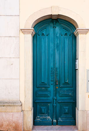 Wooden Door in the Wall of Portuguese Homeの写真素材
