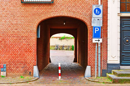 Arched Entrance to the Courtyard in the Dutch City of Zutphenの写真素材