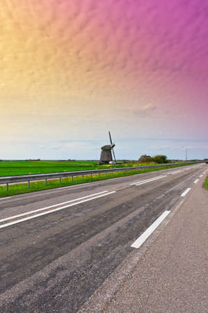 Old Dutch Windmill at the Modern Highwayの写真素材