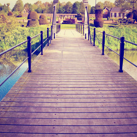 drawbridge over canal in the park in netherlands,の写真素材