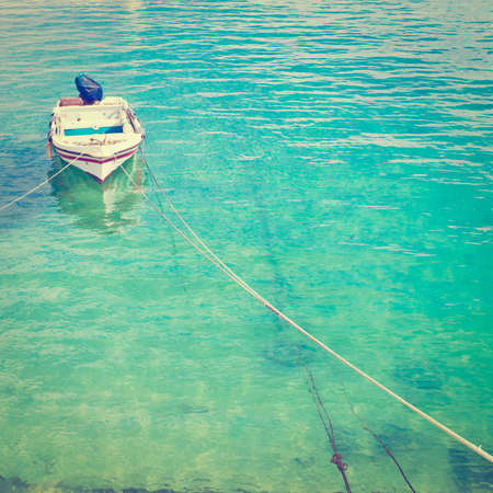 Boat in a Quiet Harbor on the Atlantic Coast of Portugal, Retro Effectの写真素材