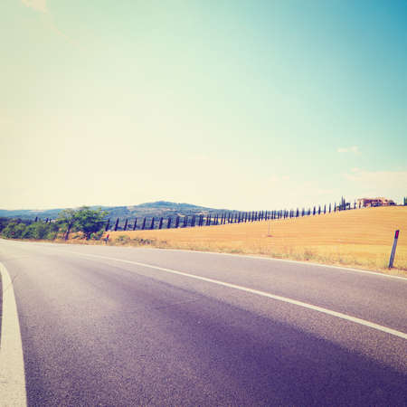  The Farmer's House in Tuscany near Asphalt Road, Retro Effectの写真素材