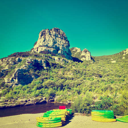 Kayaks on the River Bank in the French Alps, Retro Effectの写真素材